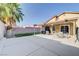 Spacious backyard with concrete patio, covered area, and mature palm trees at 1708 Anzio St, Las Vegas, NV 89108