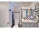Bathroom with vanity, unique mirror backsplash, toilet, and a shower-tub combination at 1708 Anzio St, Las Vegas, NV 89108