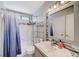 Bathroom featuring a shower-tub combination, toilet, shelving, and modern fixtures at 1708 Anzio St, Las Vegas, NV 89108