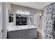 Bathroom featuring dual sinks, a shower-tub combination, and a mirrored vanity at 1708 Anzio St, Las Vegas, NV 89108