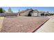 Charming single-story home featuring a well-kept front yard with desert landscaping and a private gated entrance at 1708 Anzio St, Las Vegas, NV 89108