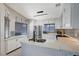 Bright kitchen with white cabinets, stainless steel appliances and stone countertops at 1708 Anzio St, Las Vegas, NV 89108