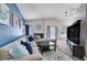 Spacious living area featuring a vaulted ceiling, contemporary furnishings, and seamless flow into the kitchen at 1708 Anzio St, Las Vegas, NV 89108