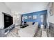 Stylish living room enhanced by a striking blue accent wall, comfortable seating, and a cozy fireplace at 1708 Anzio St, Las Vegas, NV 89108