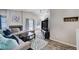 Bright living space with a fireplace, contemporary decor, and open layout flowing seamlessly into the adjacent kitchen at 1708 Anzio St, Las Vegas, NV 89108