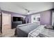 Spacious main bedroom with a walk-in closet and ensuite bathroom featuring double sinks and modern finishes at 1708 Anzio St, Las Vegas, NV 89108