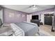 A cozy main bedroom with wood floors, closet, ensuite bath, and neutral paint at 1708 Anzio St, Las Vegas, NV 89108