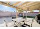 Enjoy outdoor dining on this covered patio with decorative concrete and string lights at 1708 Anzio St, Las Vegas, NV 89108