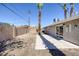 Large backyard featuring desert landscaping and sliding glass doors at 2005 Jansen Ave, Las Vegas, NV 89101