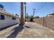 Wide desert backyard with privacy wall, house, and mature trees at 2005 Jansen Ave, Las Vegas, NV 89101