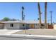 Beautifully landscaped single-story home with a bright orange front door at 2005 Jansen Ave, Las Vegas, NV 89101