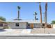 Charming single-story home featuring desert landscaping and an inviting orange front door at 2005 Jansen Ave, Las Vegas, NV 89101
