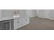 Bright kitchen with stainless steel dishwasher and quartz countertops, leads to additional living area at 2005 Jansen Ave, Las Vegas, NV 89101