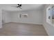 Living room features light wood floors, neutral paint, and a modern ceiling fan at 2005 Jansen Ave, Las Vegas, NV 89101