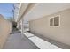 This covered patio includes a concrete foundation, access to a fenced side yard, and a window into the house at 2005 Jansen Ave, Las Vegas, NV 89101
