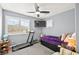 This bedroom includes a Superfit treadmill and windows with bright light at 262 Cielito Lindo St, Henderson, NV 89012
