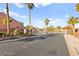 A gated community entrance, with palm trees and manicured desert landscaping at 262 Cielito Lindo St, Henderson, NV 89012