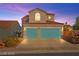 Charming two-story home featuring a two-car garage with turquoise doors and a well-maintained front yard at 262 Cielito Lindo St, Henderson, NV 89012
