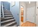 Carpeted staircase leads to the second floor, with a glimpse of the bathroom at 262 Cielito Lindo St, Henderson, NV 89012