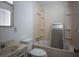 A bathroom with a tub and shower includes built-in shelving and a single-sink vanity at 2721 Merritt Ave, Las Vegas, NV 89102