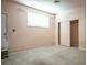 Empty bedroom featuring neutral-colored walls, tile flooring, and a closet with sliding doors at 2721 Merritt Ave, Las Vegas, NV 89102