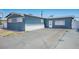 Simple home exterior with a large driveway and a front entrance, offering convenient access at 2721 Merritt Ave, Las Vegas, NV 89102