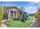 Playground with turf lawn, climbing wall, and swing set at 2931 Raywood Ash Dr, Las Vegas, NV 89138
