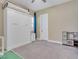 Cozy bedroom includes a Murphy bed, neutral carpet, and a miniature kitchen set at 2931 Raywood Ash Dr, Las Vegas, NV 89138