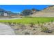 Expansive green area nestled in a community with desert landscaping, offering a serene outdoor space at 2931 Raywood Ash Dr, Las Vegas, NV 89138