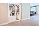 Secret bookshelf door leads to a hidden room with kitchen view, adding unique charm to the home at 2931 Raywood Ash Dr, Las Vegas, NV 89138