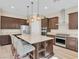 Spacious kitchen with stainless steel appliances, granite countertops, and a large central island at 2931 Raywood Ash Dr, Las Vegas, NV 89138