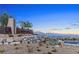 Welcome to Reverence: Stone and metal monument amidst desert landscaping offers scenic mountain views at 2931 Raywood Ash Dr, Las Vegas, NV 89138