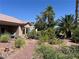 Backyard with plants and trees with a view of patio furniture at 3028 Ripon Dr, Las Vegas, NV 89134