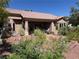 Exterior of backyard patio with desert landscaping and covered porch at 3028 Ripon Dr, Las Vegas, NV 89134
