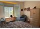 Bedroom with bay window, carpet flooring, and light blue accent wall at 3028 Ripon Dr, Las Vegas, NV 89134