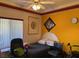 Bright bedroom with chair, wheelchair, and black bedding at 3028 Ripon Dr, Las Vegas, NV 89134