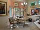 Bright dining area with chandelier, large windows, and tile floors at 3028 Ripon Dr, Las Vegas, NV 89134
