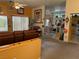 Open-concept living room and kitchen area featuring plush carpet flooring and a variety of stylish decor at 3028 Ripon Dr, Las Vegas, NV 89134