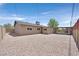 Spacious backyard features stone landscaping, privacy walls, and a built-in outdoor grilling area at 3101 Greenbriar Dr, Las Vegas, NV 89121