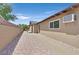 Backyard featuring a covered patio area, stone landscaping, and privacy walls at 3101 Greenbriar Dr, Las Vegas, NV 89121