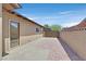 Backyard featuring a well-maintained concrete walkway and privacy walls at 3101 Greenbriar Dr, Las Vegas, NV 89121