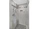 Beautiful tile in the shower offers two shower heads and a built in shelf at 3101 Greenbriar Dr, Las Vegas, NV 89121