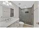 Updated bathroom featuring a tiled walk-in shower with a marble countertop vanity at 3101 Greenbriar Dr, Las Vegas, NV 89121