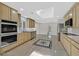 Spacious kitchen with updated appliances, tile flooring, granite countertops, and a skylight at 3101 Greenbriar Dr, Las Vegas, NV 89121