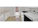 Bright laundry room includes modern washer and dryer units, as well as ample counter space at 3101 Greenbriar Dr, Las Vegas, NV 89121