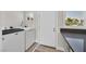 Convenient laundry area with modern machines, a view to the backyard and ample counter space at 3101 Greenbriar Dr, Las Vegas, NV 89121