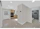 Open living room that includes a view to the kitchen and a glimpse of the bathroom at 3101 Greenbriar Dr, Las Vegas, NV 89121