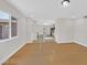 Open-concept living room featuring hardwood floors and a view of the kitchen at 3101 Greenbriar Dr, Las Vegas, NV 89121