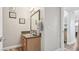Bathroom vanity with granite countertops and modern fixtures, view to hallway at 3145 E Flamingo Rd # 1045, Las Vegas, NV 89121