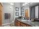 Bathroom showcasing granite countertops, wooden cabinets, and a well-lit vanity area at 3145 E Flamingo Rd # 1045, Las Vegas, NV 89121